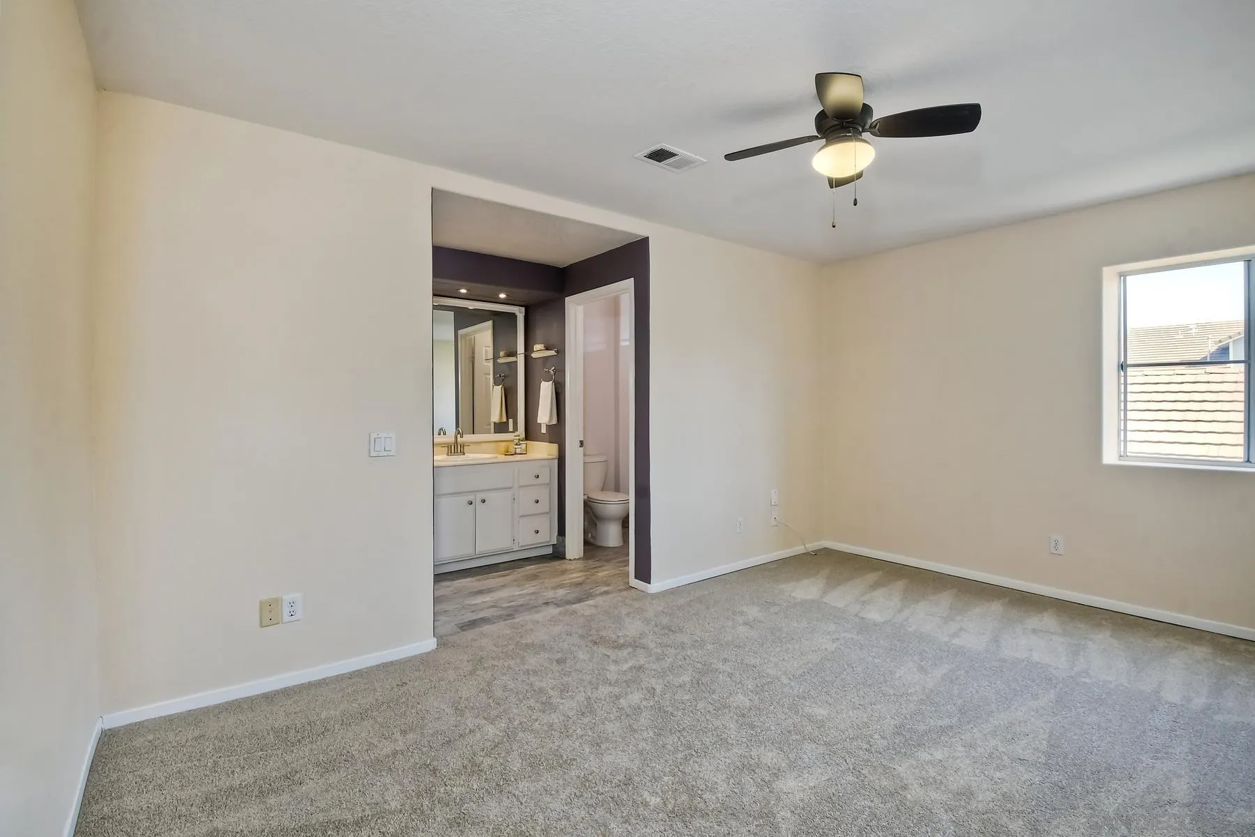 13921 Midland Road Poway, CA 92064 - Photo 10 of 25 an empty room with fan and windows