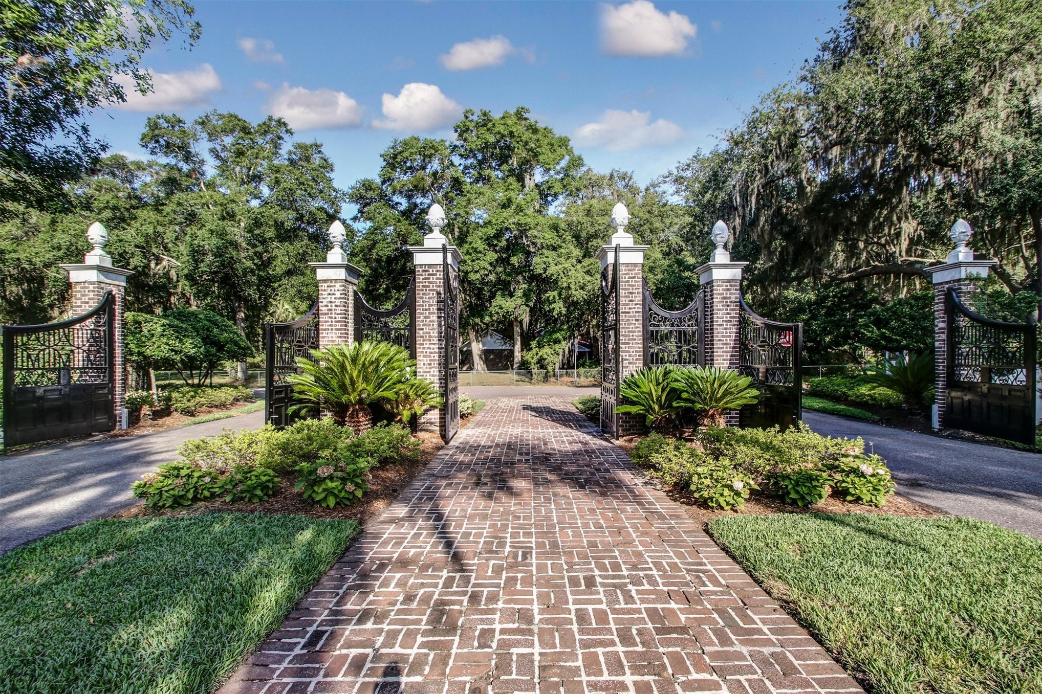 28857 Grandview Manor Yulee, FL 32097 - Photo 24 of 41 a view of a pathway with flower plants and large trees