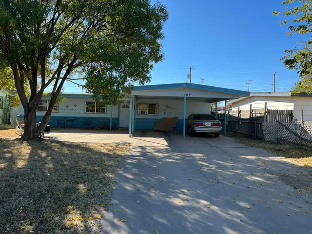 a car parked in front of a house