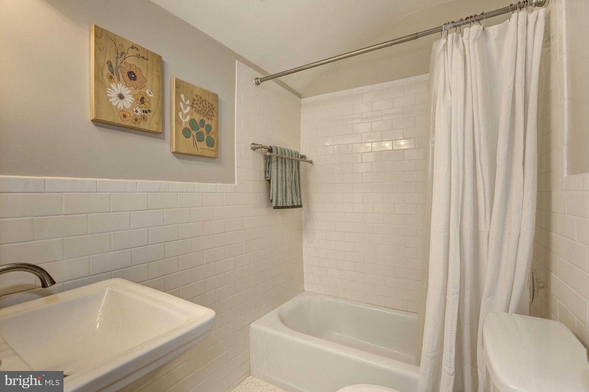 4908 River Road Bethesda, MD 20816 - Photo 19 of 26 Newly renovated hall bath w/ shower & tub