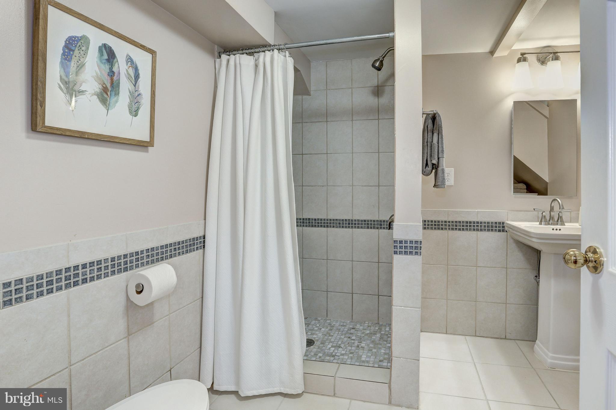 4908 River Road Bethesda, MD 20816 - Photo 24 of 26 Renovated and welcoming full bath on lower level