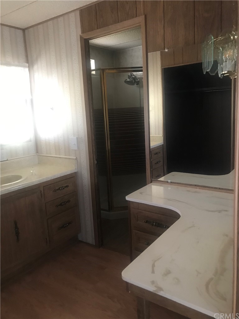 44717 Woodrow Way Hemet, CA 92544 - Photo 2 of 15 a bathroom with a sink and a mirror