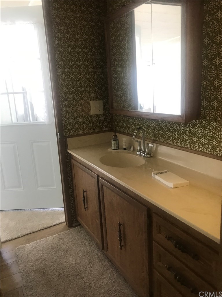 44717 Woodrow Way Hemet, CA 92544 - Photo 5 of 15 a bathroom with a sink and a bathtub