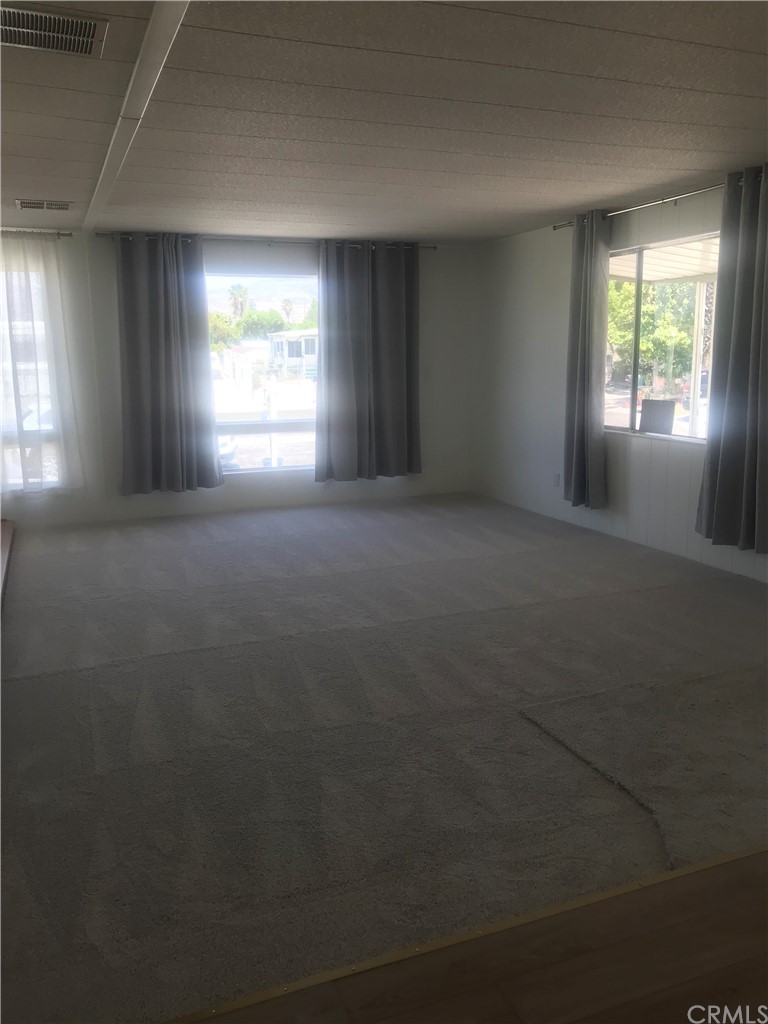 44717 Woodrow Way Hemet, CA 92544 - Photo 8 of 15 an empty room with windows