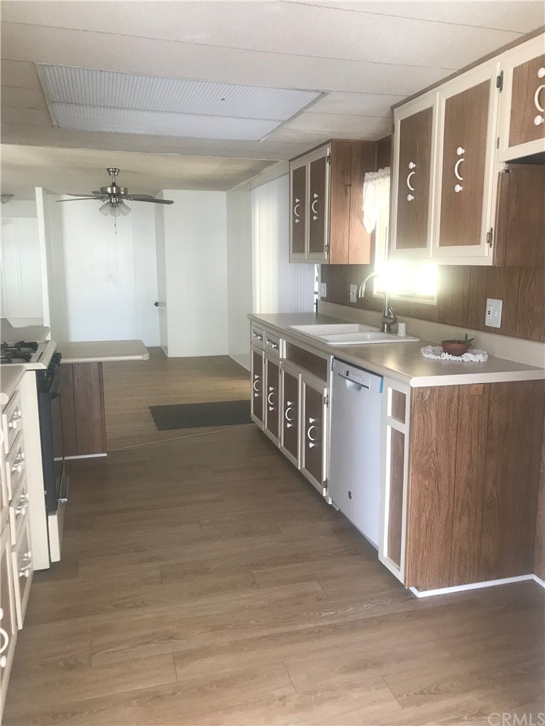 44717 Woodrow Way Hemet, CA 92544 - Photo 10 of 15 a kitchen with stainless steel appliances granite countertop a sink and a stove
