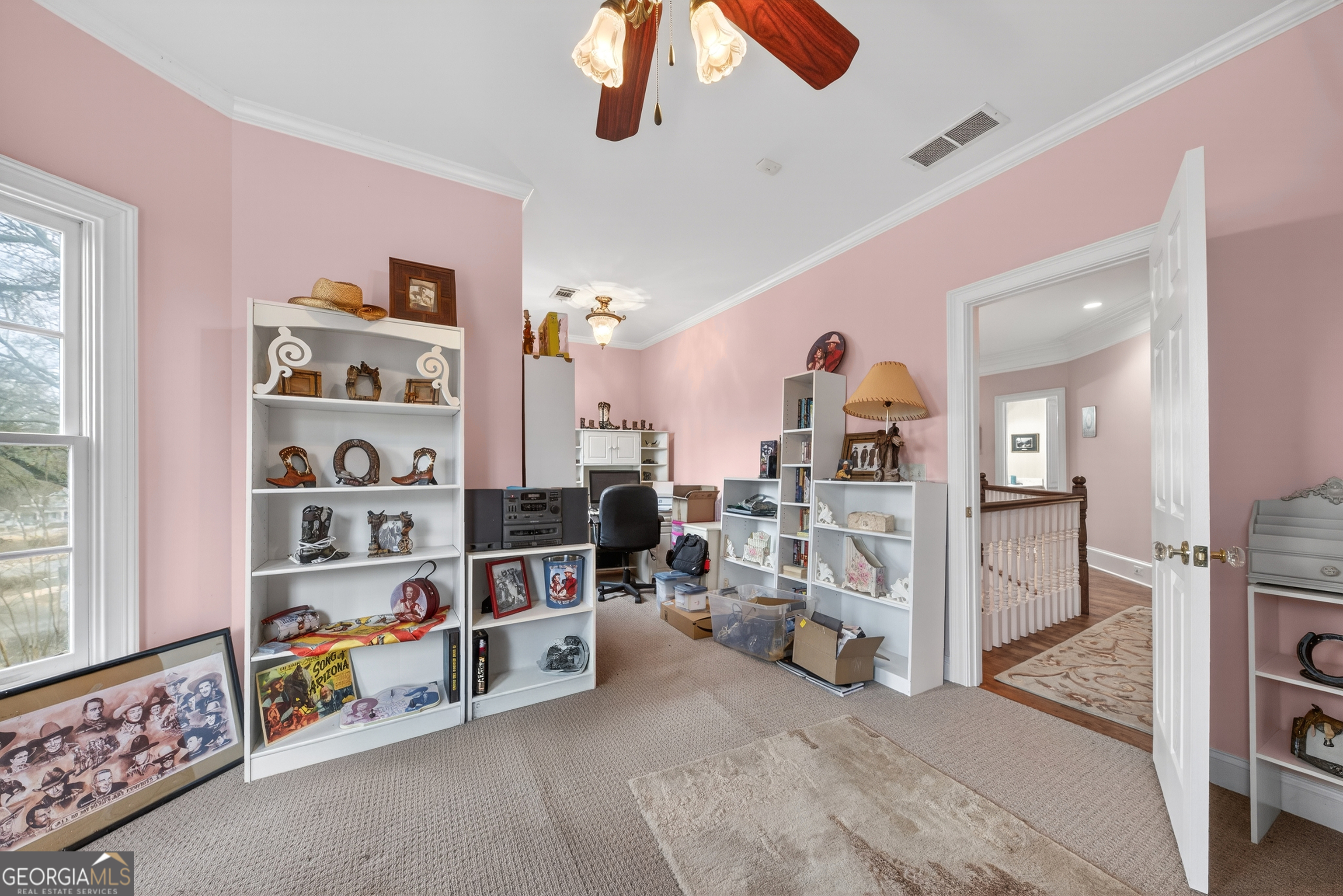 516 Hillside Road Madison, GA 30650 - Photo 13 of 27 a living room with furniture and a book shelf