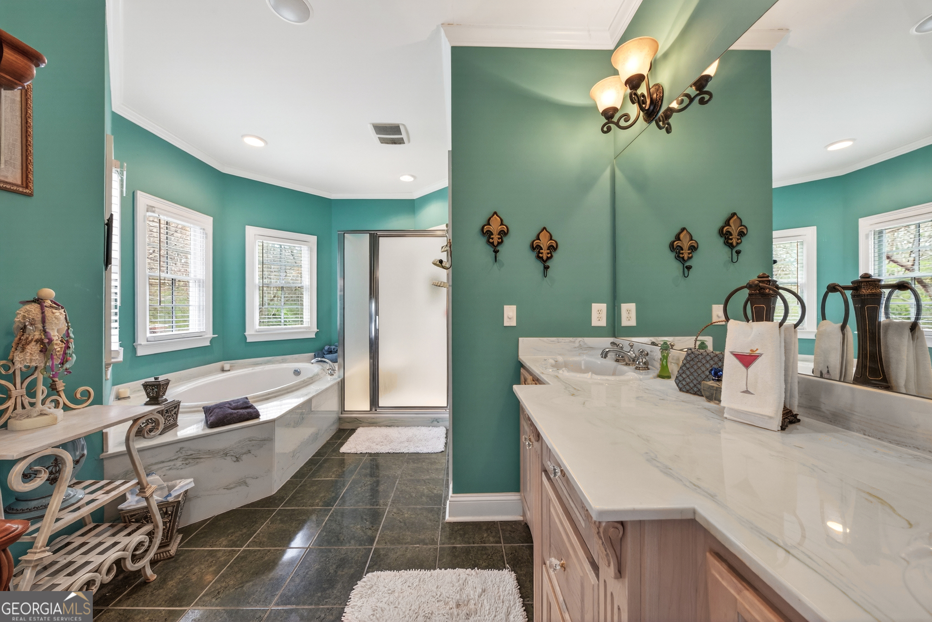 516 Hillside Road Madison, GA 30650 - Photo 19 of 27 a living room with kitchen island furniture and a chandelier