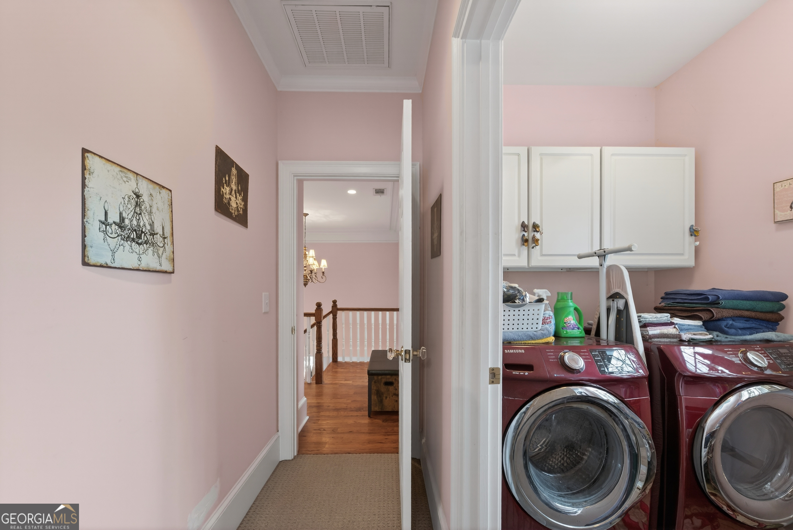 516 Hillside Road Madison, GA 30650 - Photo 22 of 27 a view of a hallway with washer and dryer