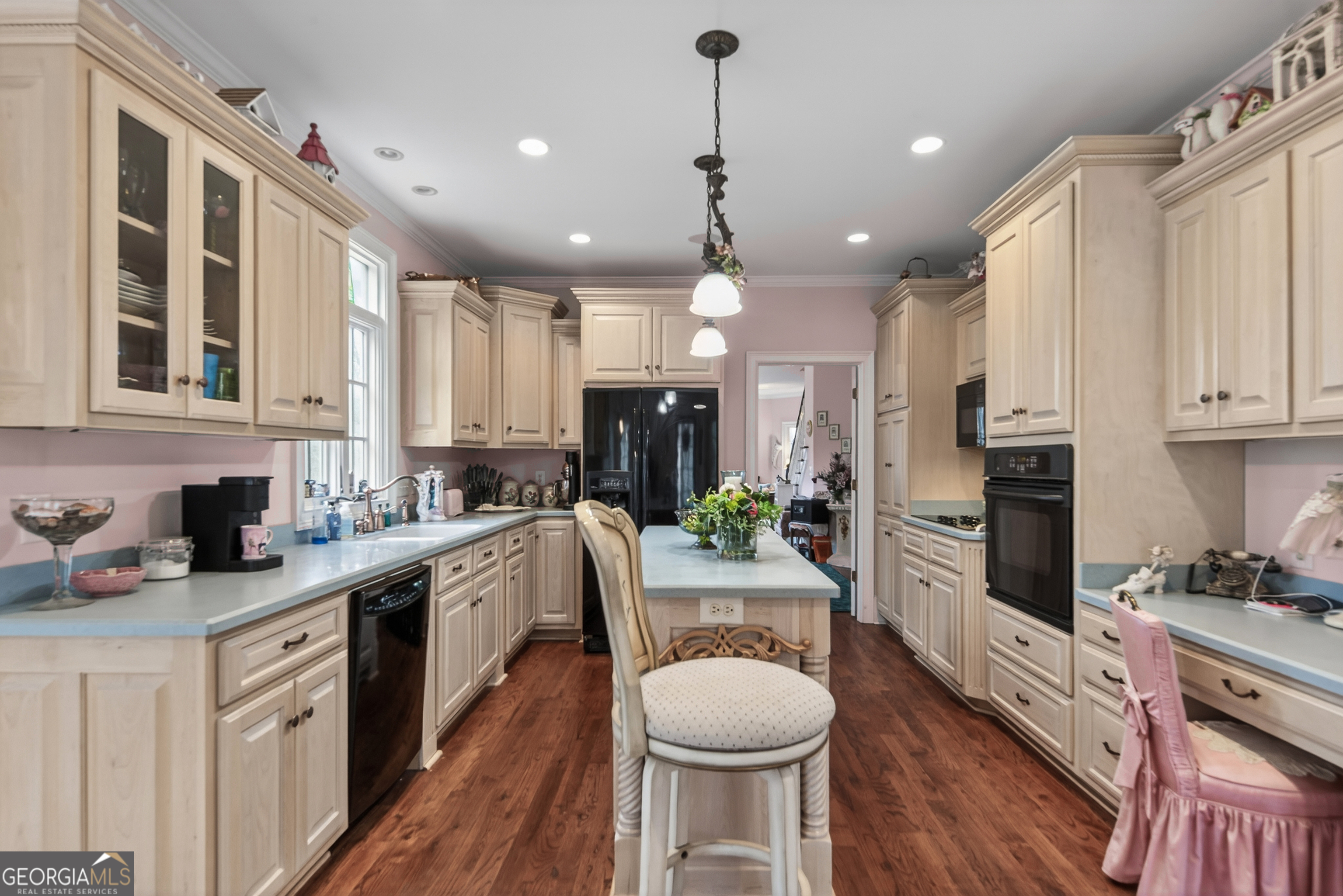 516 Hillside Road Madison, GA 30650 - Photo 7 of 27 a kitchen with a sink stove cabinets and refrigerator