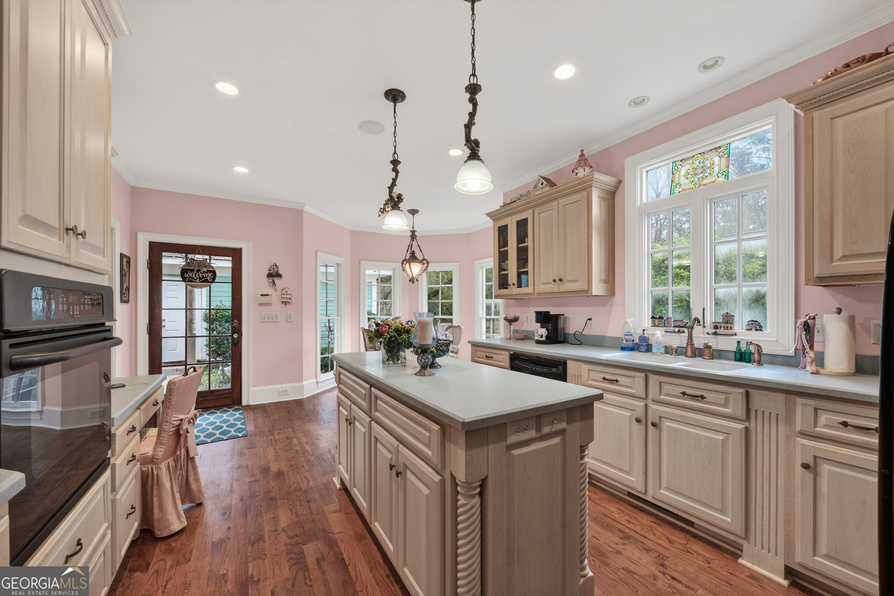 516 Hillside Road Madison, GA 30650 - Photo 8 of 27 a kitchen with a sink stove and cabinets
