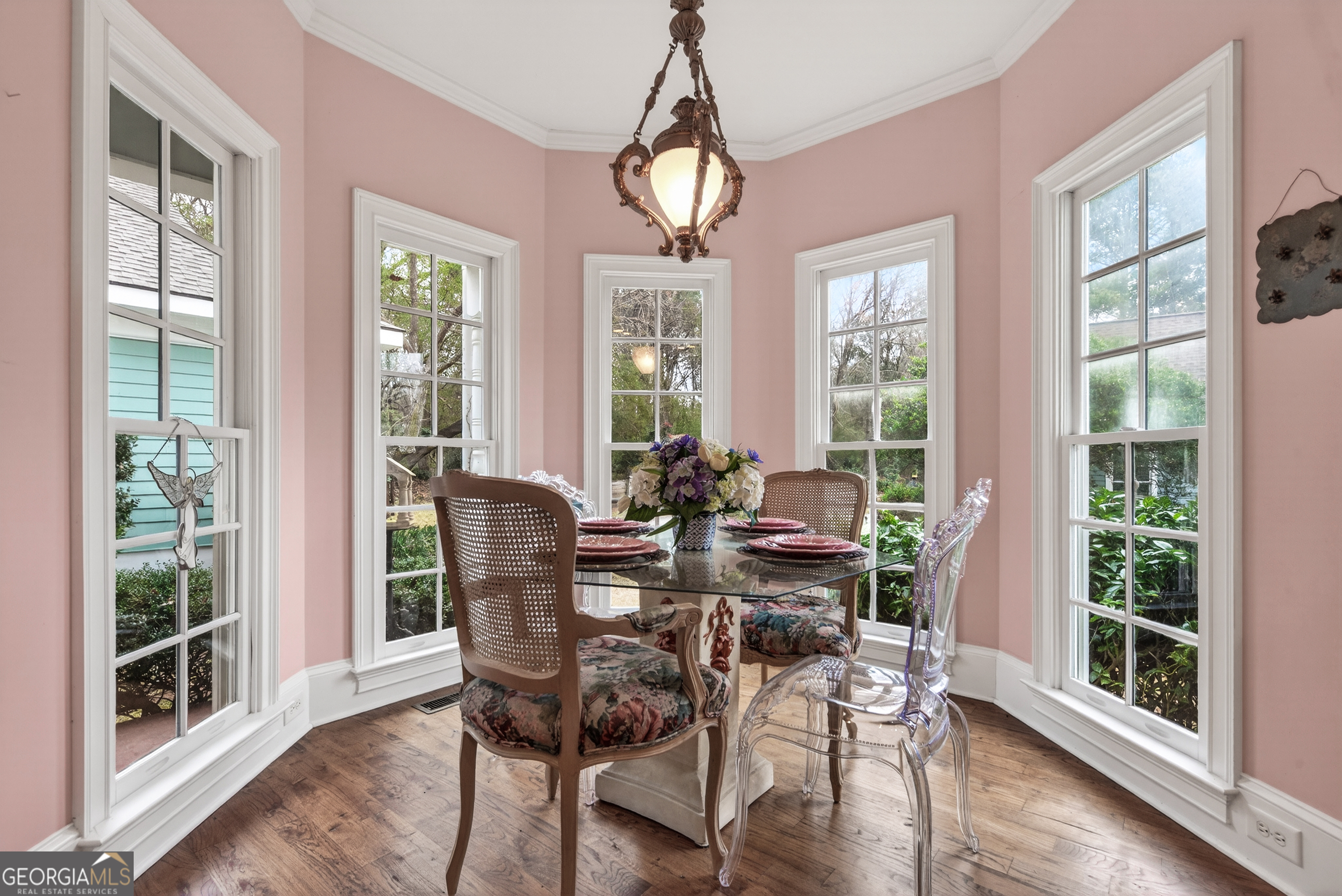 516 Hillside Road Madison, GA 30650 - Photo 9 of 27 a view of a dining room with furniture window and wooden floor