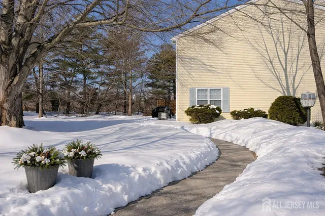 a view of a garden with chair and tables
