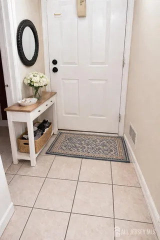 a view of a bathroom with a sink and a mirror