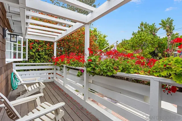 a view of a chairs and table in the balcony