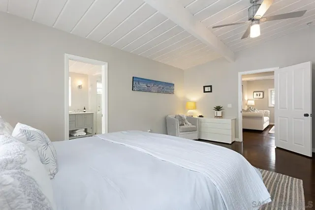 a bedroom with a bed and a couch