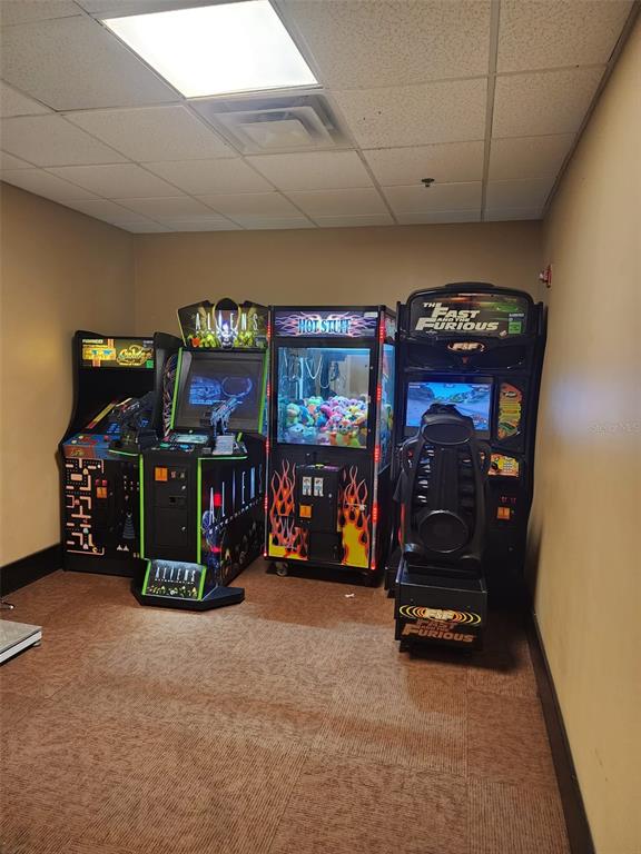 7601 Canada Avenue, Unit 618 Orlando, FL 32819 - Photo 14 of 19 a living room with furniture and a flat screen tv