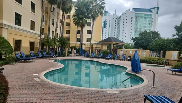 a view of a swimming pool with a patio