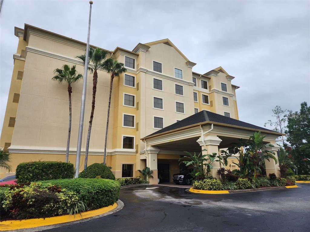 7601 Canada Avenue, Unit 618 Orlando, FL 32819 - Photo 2 of 19 a front view of a building with yellow lighting