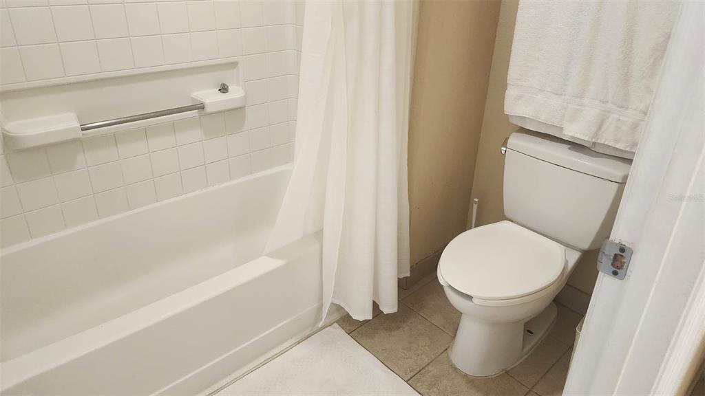 7601 Canada Avenue, Unit 618 Orlando, FL 32819 - Photo 9 of 19 a bathroom with a sink and a toilet