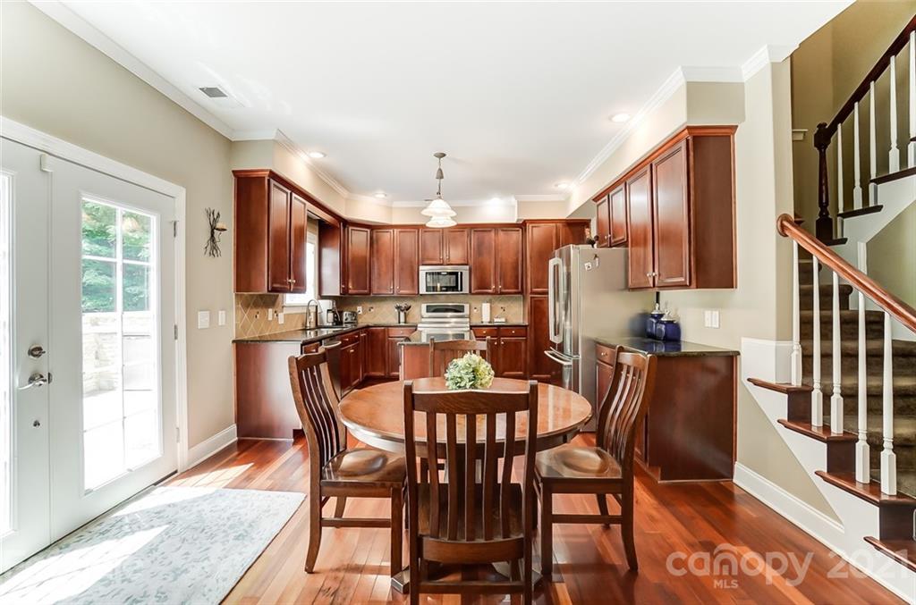 1100 Blacksnake Road Stanley, NC 28164 - Photo 14 of 48 a dining room with furniture and a kitchen view