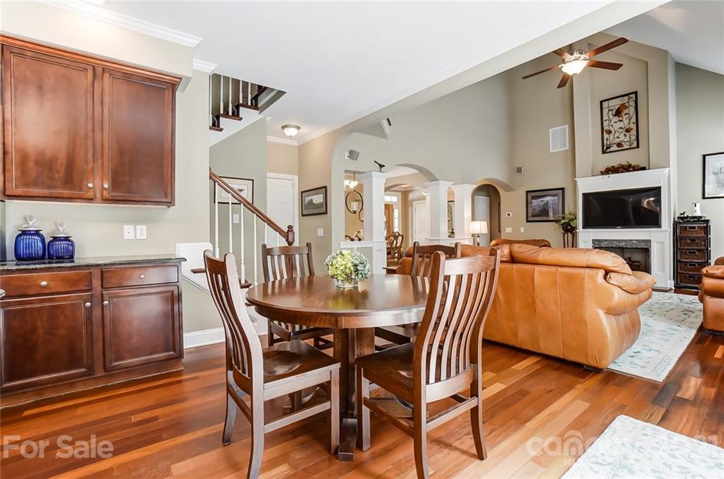 1100 Blacksnake Road Stanley, NC 28164 - Photo 15 of 48 a view of a dining room with furniture and a kitchen