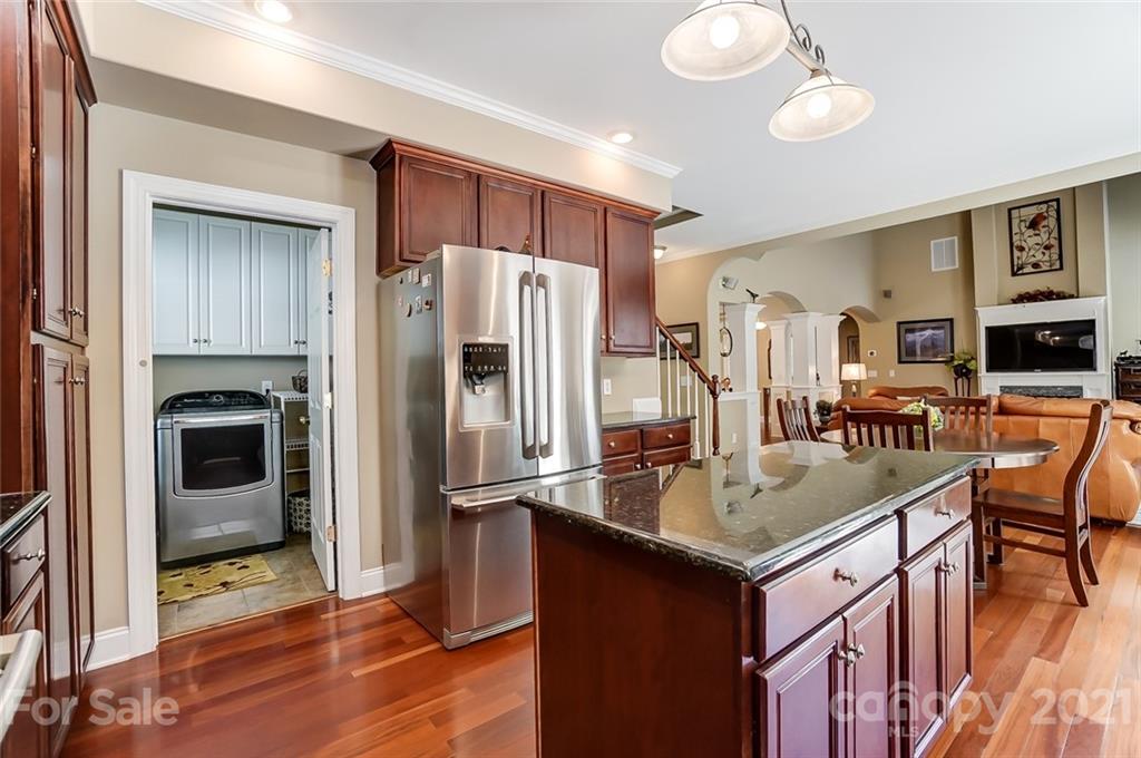 1100 Blacksnake Road Stanley, NC 28164 - Photo 17 of 48 a kitchen with stainless steel appliances granite countertop a refrigerator a stove and a sink