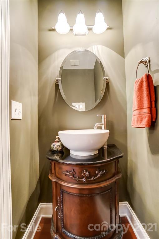 1100 Blacksnake Road Stanley, NC 28164 - Photo 19 of 48 a bathroom with a mirror and a sink