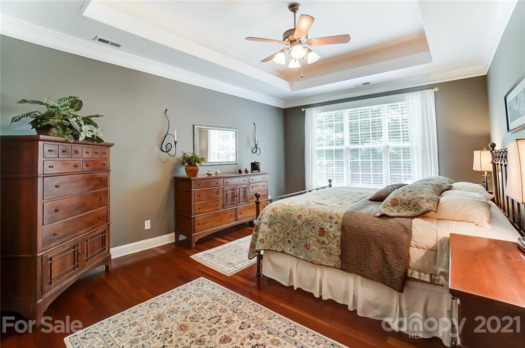 1100 Blacksnake Road Stanley, NC 28164 - Photo 20 of 48 a bedroom with a bed and a dresser