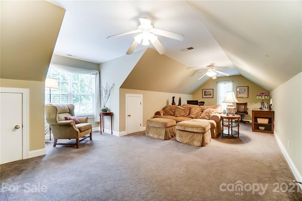 1100 Blacksnake Road Stanley, NC 28164 - Photo 30 of 48 a living room with furniture and white walls