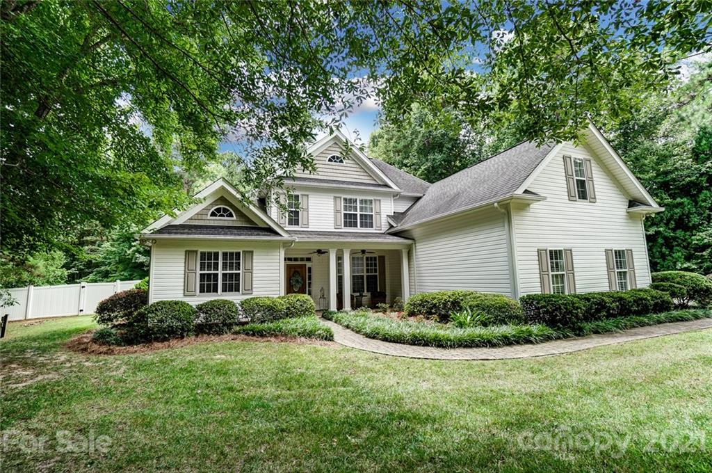 1100 Blacksnake Road Stanley, NC 28164 - Photo 4 of 48 a front view of house with yard and trees around