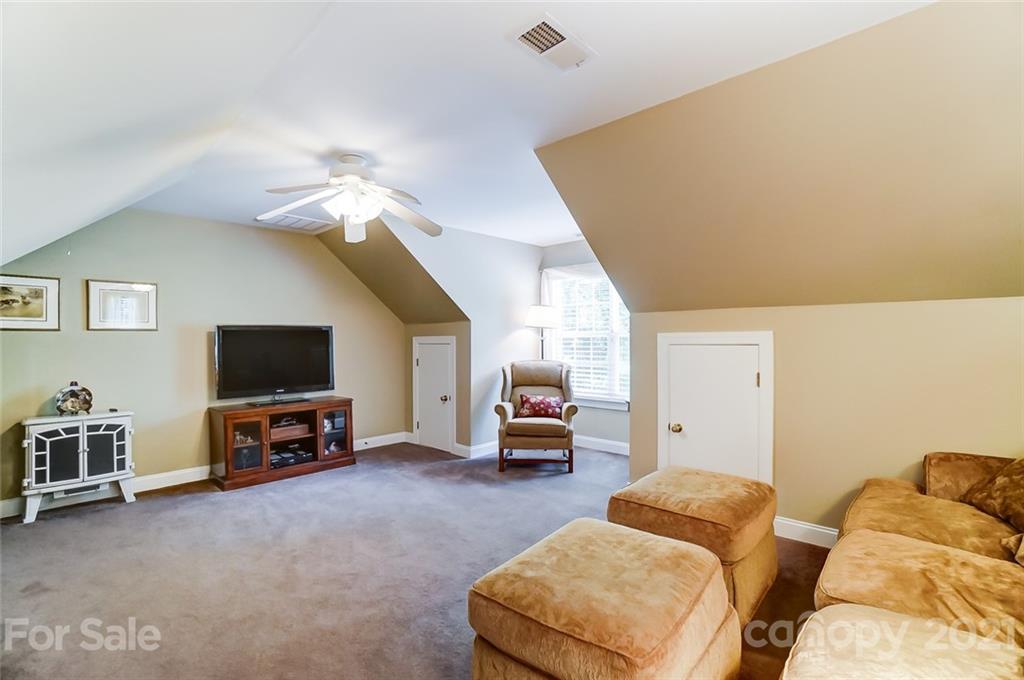 1100 Blacksnake Road Stanley, NC 28164 - Photo 31 of 48 a living room with furniture and a flat screen tv