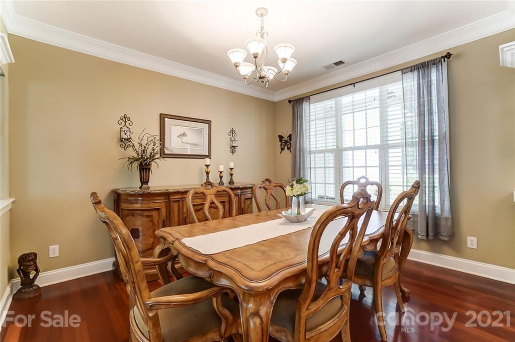 1100 Blacksnake Road Stanley, NC 28164 - Photo 8 of 48 a view of a dining room with furniture and chandelier