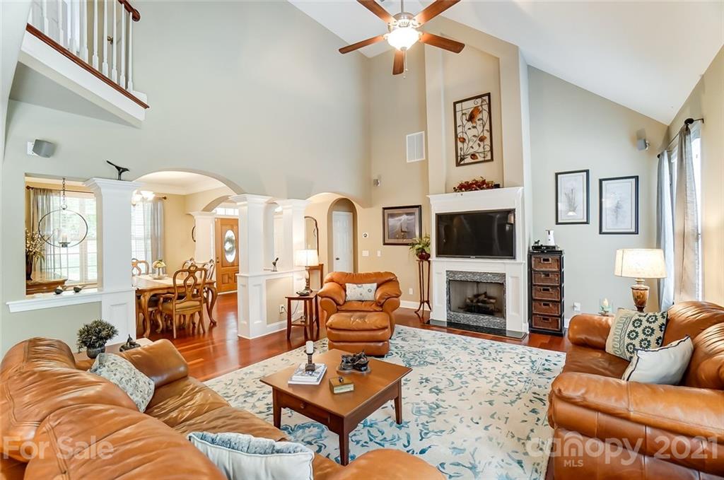 1100 Blacksnake Road Stanley, NC 28164 - Photo 10 of 48 a living room with fireplace furniture and a flat screen tv