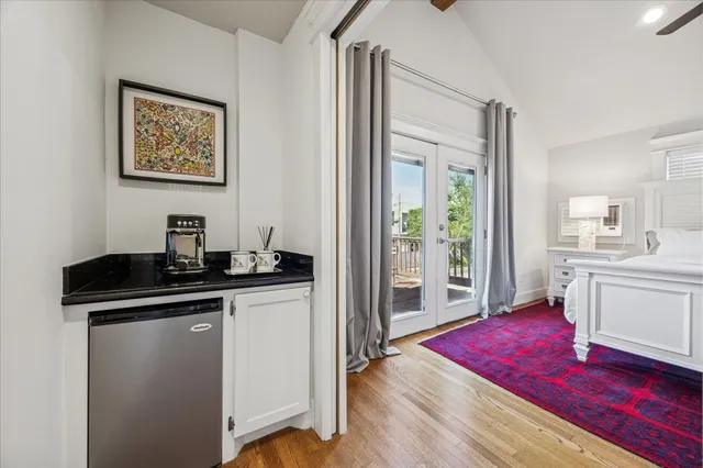 a living room with fireplace furniture and a wooden floor