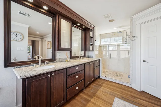 a kitchen with sink cabinets and wooden floor