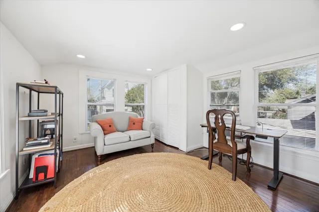 a bedroom with a bed and a table