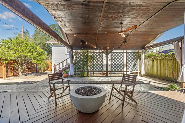a view of a house with a yard and sitting area
