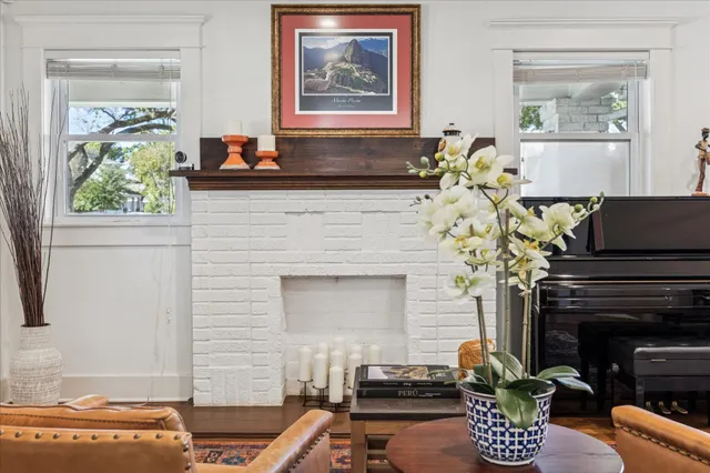 a living room with furniture and a fireplace