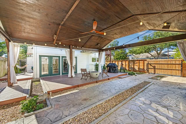 a view of a backyard with porch and outdoor space