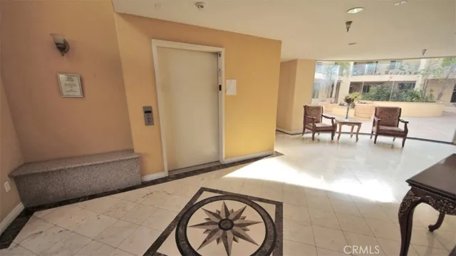 a view of a livingroom with furniture and a window