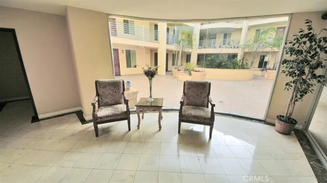 a view of a living room with furniture and a window