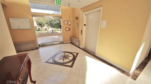 a view of a hallway with windows