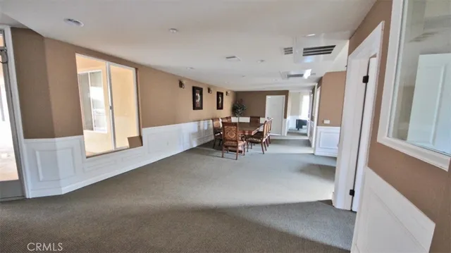 a front view of a house with a tree