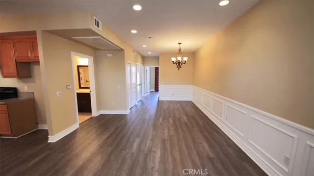 a view of hallway with wooden floor