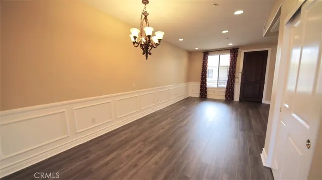 a view of a room with wooden floor and staircase