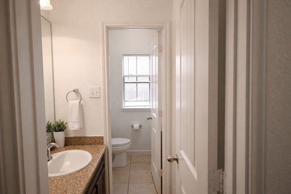 250 7th Street Hempstead, TX 77445 - Photo 16 of 26 a bathroom with a sink toilet and shower
