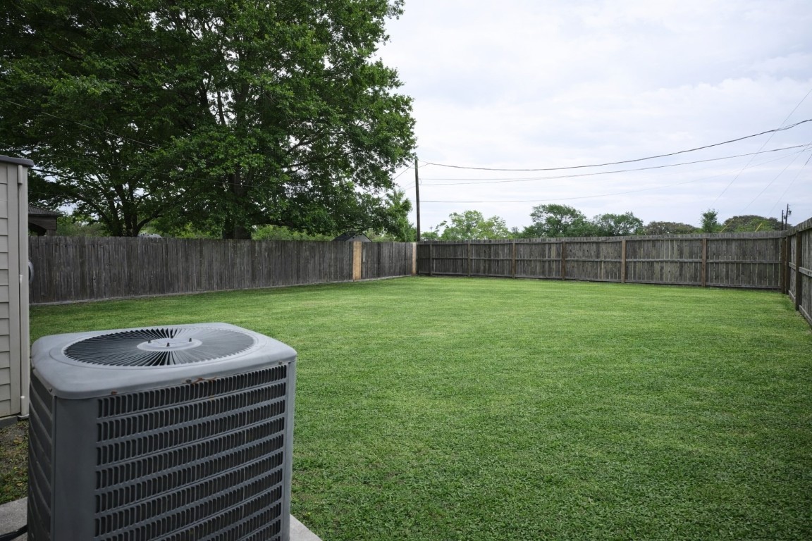 250 7th Street Hempstead, TX 77445 - Photo 21 of 26 a view of a backyard with a garden