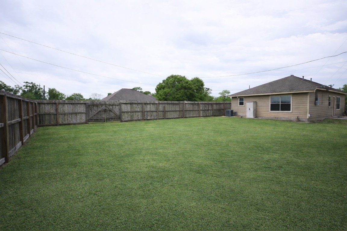 250 7th Street Hempstead, TX 77445 - Photo 23 of 26 a view of a house with a yard and sitting area