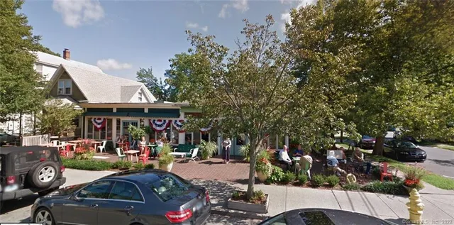a view of street with parked cars