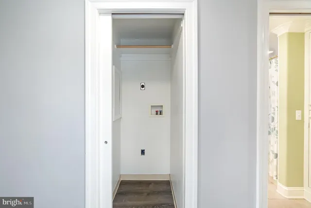 a view of a bathroom from a hallway